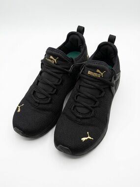 Puma Black Sneakers with Gold Branding